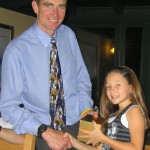 Sean Yates presents an award to youngest Wheeler Lucy Bryant