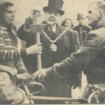 Jim Sargent and Mrs. Sargent hold the torch as the Mayor of Westminster lights the flame that will be carried 60 miles to Rye to light the Rye Bonfire of 1948